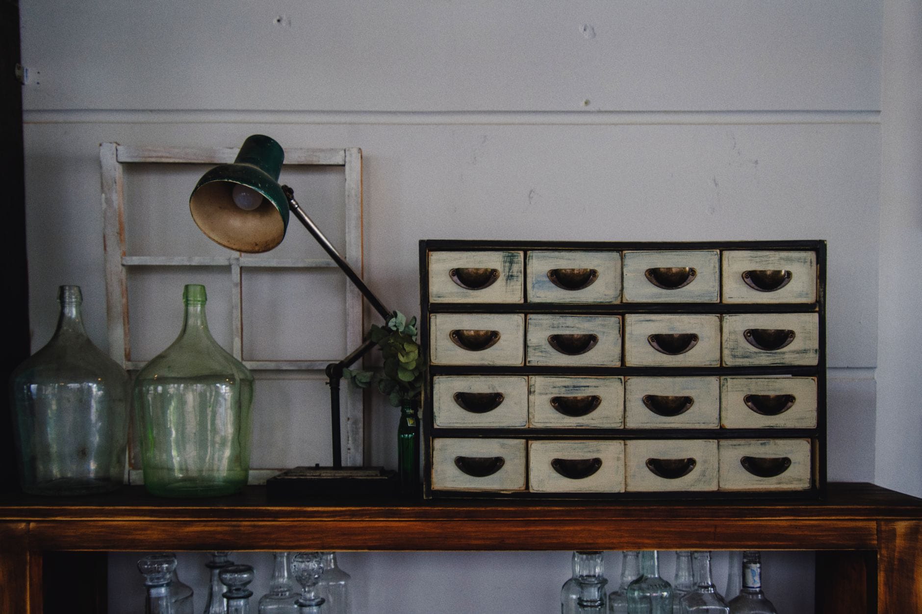 Old wooden library card catalog with many small labeled drawers