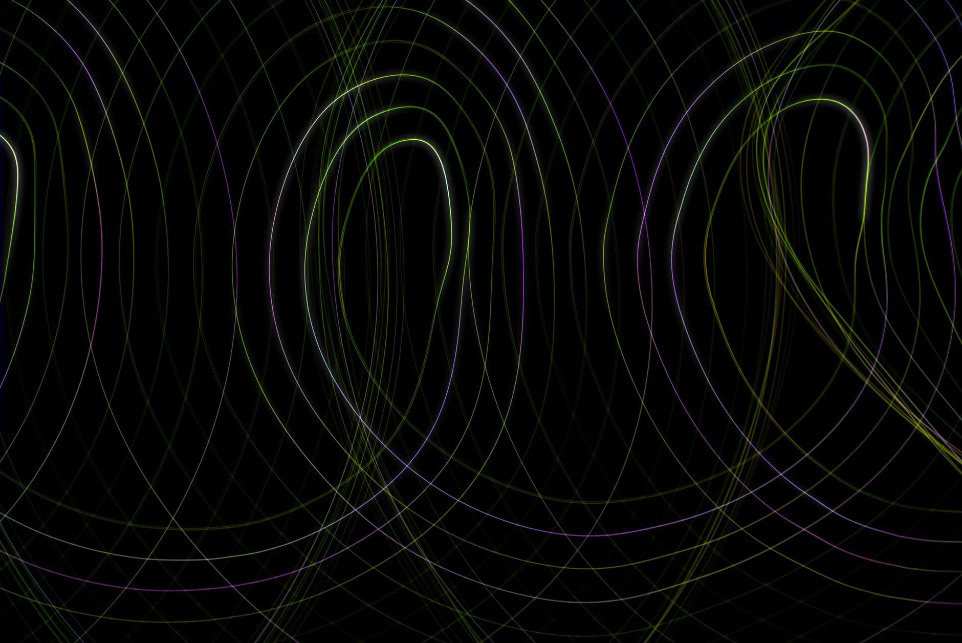 Captivating abstract design with loops and lines on a dark backdrop, ideal for modern projects.