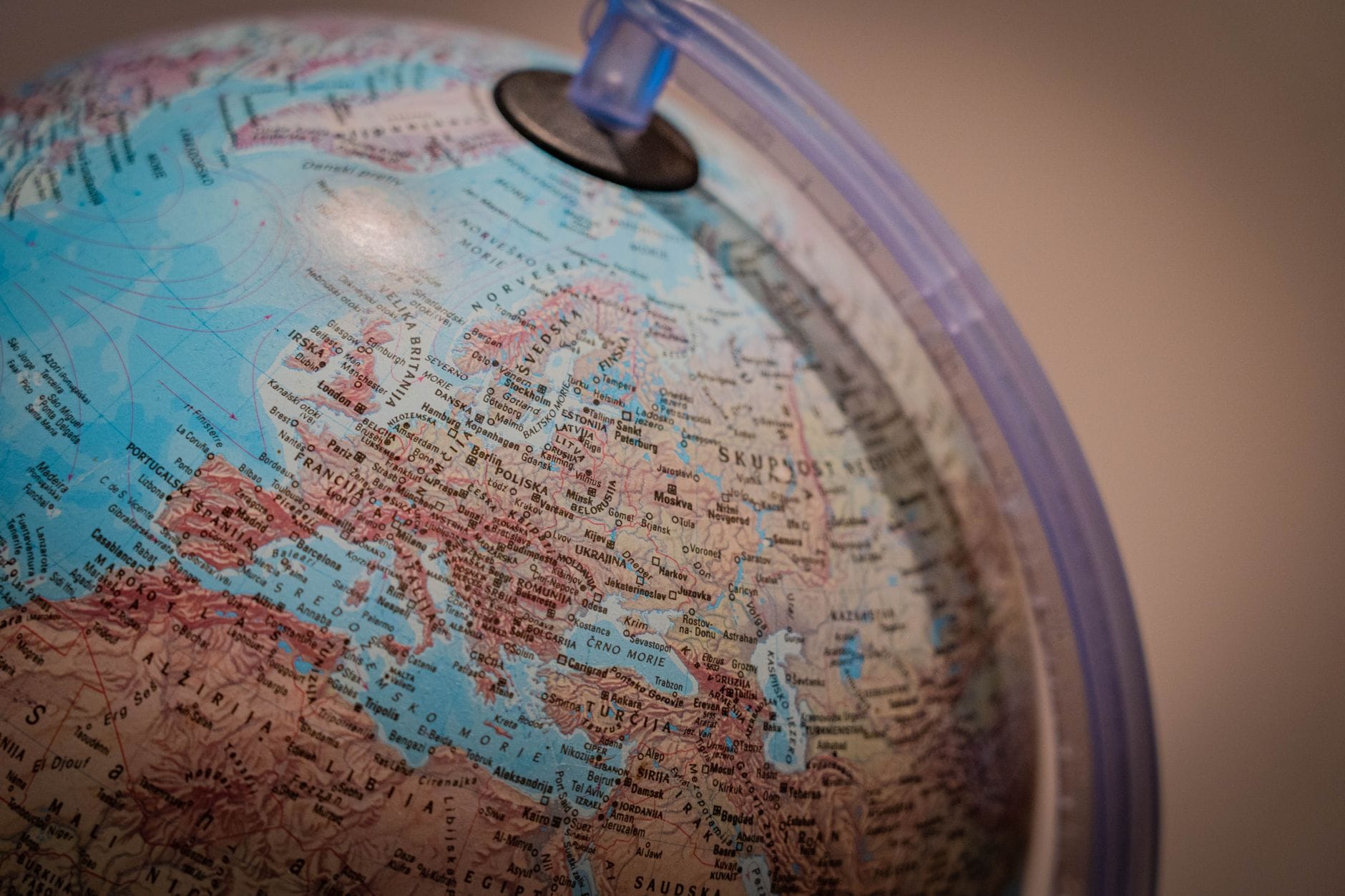 Detailed close-up shot of a world globe displaying European countries for educational purposes.